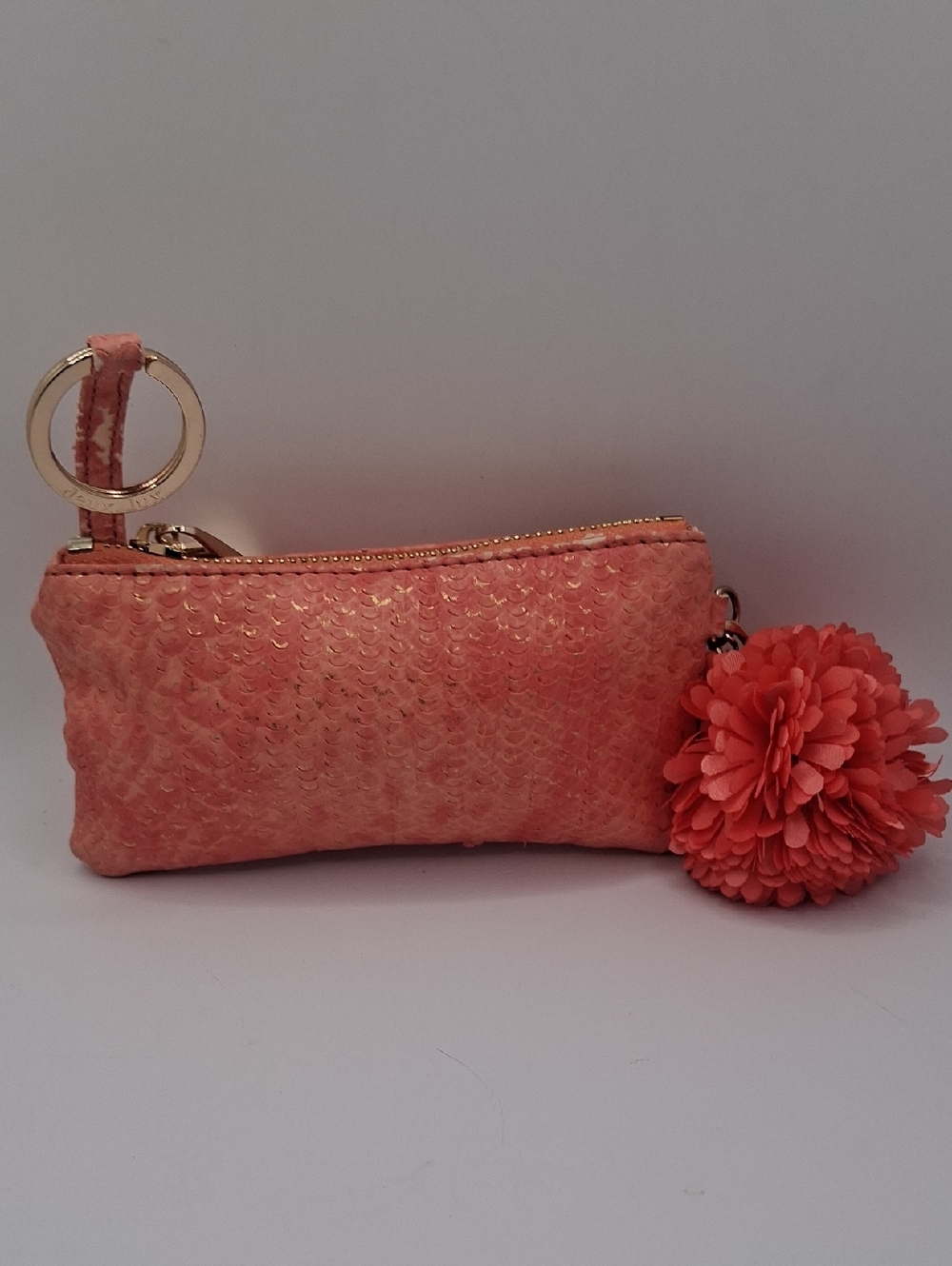 Deux Lux Coral Sequin Wristlet with Pom Pom Accent Peach